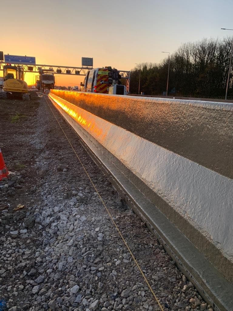 Highway concrete curb with sunset